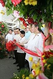 Accompanied by national and local officials, President Gloria Macapagal Arroyo at ribbon cutting ceremony, June 13, 2007 Iloilo Airport Opening.jpg