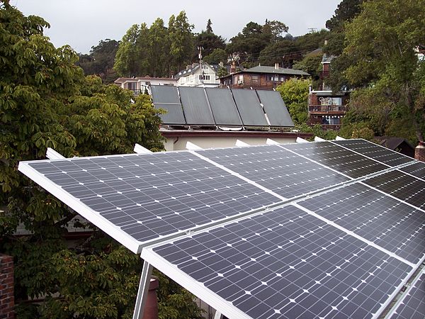 Photovoltaic (foreground) and Solar water heating (rear) panels located on rooftops in Berkeley, California. Note the low tilt of the photovoltaic pan