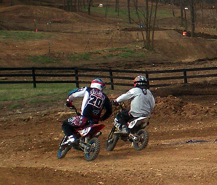 Two riders go into a corner at a mini-motocross event in West Virginia.