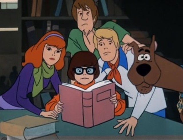 A scene from "What a Night for a Knight", the first episode of Scooby-Doo, Where Are You!. Clockwise from top: Shaggy Rogers, Fred Jones, Scooby-Doo, 