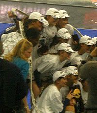 The 2008 Penn State volleyball team poses with the NCAA championship trophy after defeating Stanford University in the finals. Penn State Volleyball 2008 National Champions.jpg