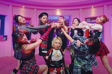 A scene in the music video shows the members performing the song's choreography in a deluxe wardrobe. Twice - The Feels (screenshot).jpg