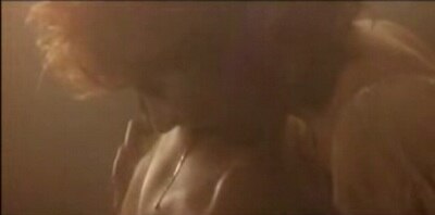 Mylène Farmer biting Frédéric Lagache, her lover in the very controversial video for "Beyond My Control".