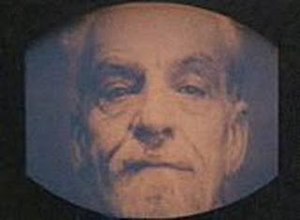 Emmanuel Goldstein (John Boswall) on a telescreen during a Two Minutes Hate programme in the film Nineteen Eighty-Four (1984) 1984EmmanuelGoldstein.jpg