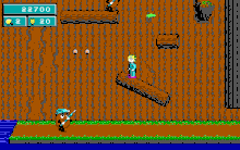 Gameplay image from the game, showing Commander Keen and a potato "Tater Trooper" enemy. To the left of Keen are two flower power pellets, while the box in the upper left shows the player's score, lives, and flower power ammo. Keen Dreams gameplay.gif