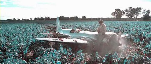 Hughes crashes in a field; screenshot showing the simulated bipack color film used in scenes depicting events before 1935