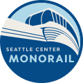 The logo of the Seattle Center Monorail system, which consists of a circular badge with a stylized monorail train