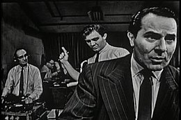 The Night America Trembled was Studio One's September 9, 1957, top-rated television recreation of Orson Welles's radio broadcast of The War of the Worlds on October 30, 1938. Alexander Scourby is seen in the foreground. Warren Beatty (not pictured), in one of his earliest roles, appeared in the bit part of a card-playing college student. Trembled.jpg