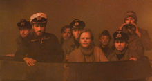 The U-96 officers. From left to right: the II. WO (Semmelrogge), the Commander (Prochnow), Navigator Kriechbaum (Tauber), the I. WO (Bengsch), Lt. Werner (Grönemeyer), Little Benjamin (Hoffmann), Cadet Ullmann (May), and Pilgrim (Fedder).