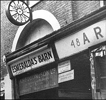 Esmeralda's Barn, with its sign based on a roulette wheel Esmeralda's Barn.jpg