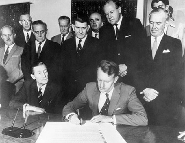 Ian Smith signing the Unilateral Declaration of Independence on 11 November 1965 with his cabinet in audience