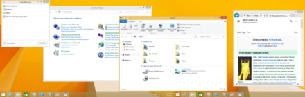 Windows 8.1 displaying the multi-monitor taskbar in "Duplicated on all taskbars" mode