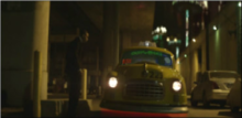 A screenshot of Brown (pictured) hailing a futuristic hover-cab in the music video. TurnUptheMusicss.png