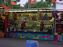 The traditional "Balloon and Dart" carnival game provided the inspiration for the original Bloons game. Balloon And Dart Booth.jpg