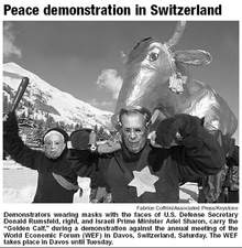 Fabrice Coffrini, AP Photo/Keystone. Click to enlarge: "sheriff" is clearly readable. Davos WEF Golden Calf.png