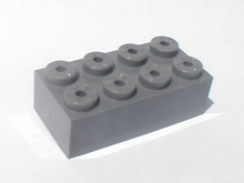 2x4 Tente brick. Note the central hole in each stud allowing secondary connection method. Tente-brick.png