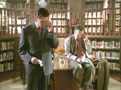 Screenshot of two Watchers: Wesley (left) and Giles (right) in "Bad Girls" (1999).