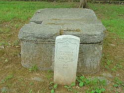 The probable burial site of Pathkiller exists in a cemetery found in the old Cherokee Nation capital of New Echota Pathkiller Tomb.JPG