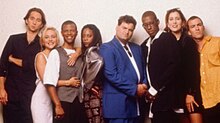 The inaugural 1995 cast of Mad TV, from left to right: David Herman, Nicole Sullivan, Phil LaMarr, Debra Wilson, Artie Lange, Orlando Jones, Mary Scheer, and Bryan Callen MadTV season 1 cast.jpg