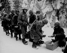 US soldiers in the Netherlands, January 1945, showing the conditions men of the 8th had to contend with in their march across France and the Low Countries. Ww2-113.jpg