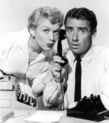 Marcia Henderson as Mickey Riley and Peter Lawford as Bill Hastings in a publicity photo for Dear Phoebe. Dear Phoebe Marcia Henderson Peter Lawford publicity photo.PNG