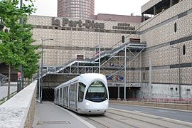 Rue Servient and tram line T1 both pass under the mall building.