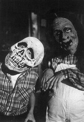 Skeleton and witch masks created by Don Post, worn by Dan Challis's (Tom Atkins) children