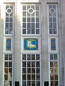 The sign of the four poster on the facade of the Tottenham Court Road store. Heal's 1917 bedding.jpg