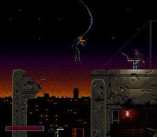 The first level is displayed in side view platform type, the health bar is displayed in the bottom left. John Spartan enters the stage by jumping with a cable from a helicopter, a scene taken from the movie DemolitionManFirstSceneReenactment.jpg