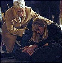 Dennis dies in the street as Sharon (right) and Pauline (left) watch on (2005) DennisDead.jpg