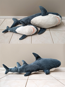 Small and large variants of Blahaj, displayed from the bottom (above) and side (below) IKEA Blahaj plush shark toys - regular and small variants - side and bottom views.png