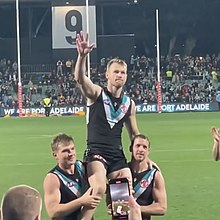 Robbie Gray being chaired off Adelaide Oval by Ollie Wines and Travis Boak in his final game, Showdown 52. Robbie Gray final game.jpg