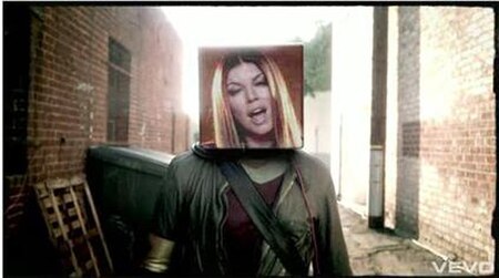 A cubic projection of Fergie materializing in place of will.i.am's head in the music video for "The Time (Dirty Bit)".