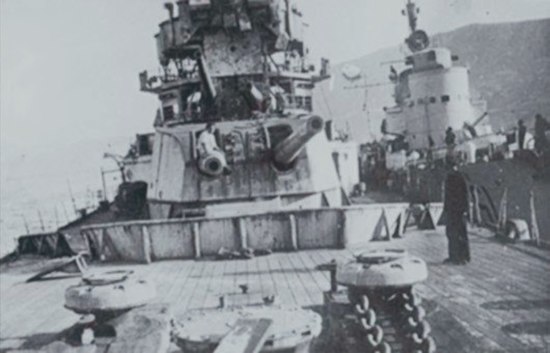 Wreck of HMS York inspected by the crew of the Italian torpedo boat Sirio, moored alongside