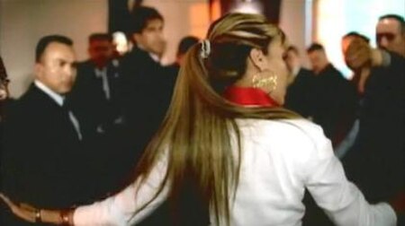 Ivy Queen in the music video for the song "Que Lloren". In this scene, Queen interrupts a meeting between men for male empowerment were the theme is "