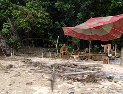 The tribe camp near the end of Survivor: Borneo. Tribes must build themselves basic shelters from natural resources and through reward items earned du