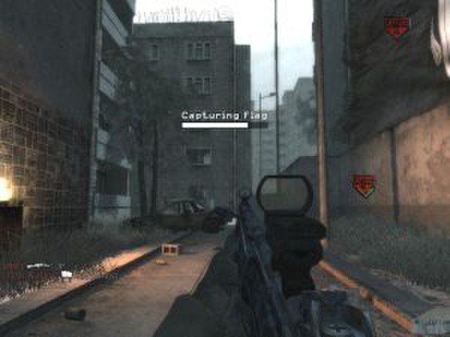 A player completes the objective of a "Domination" multiplayer game by capturing and defending three flags.