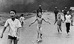 June 8, 1972: Kim Phúc, center, running down a road naked near [[Trảng Bàng]] after a [[South Vietnam Air Force]] napalm attack ([[Nick Ut]] / [[Associated Press|The Associated Press]])