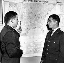 Captain Edward J. Ruppelt (left), head of Project Blue Book, at the Wright-Patterson Air Force Base project office in March 1953 Edward James Ruppelt at Bluebook (cropped).jpg
