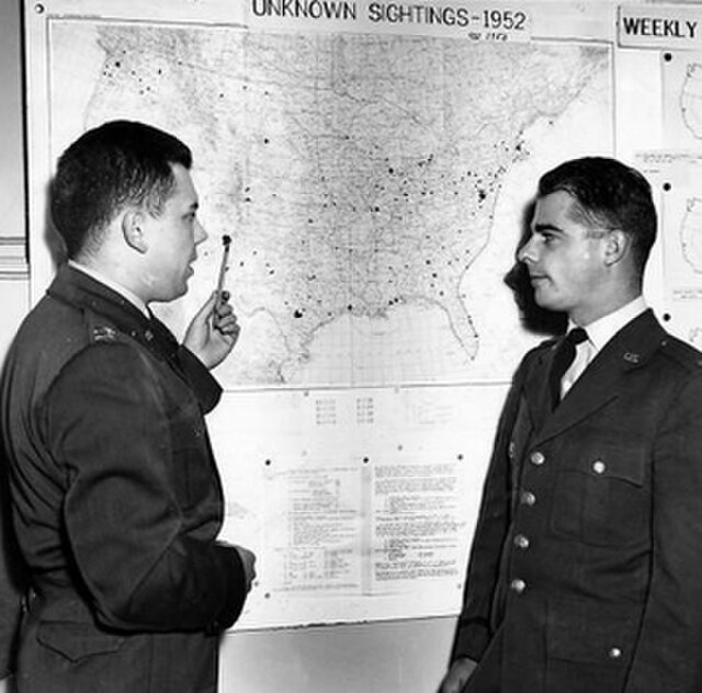 Captain Edward J. Ruppelt (left), head of Project Blue Book, at the Wright-Patterson Air Force Base project office in March 1953