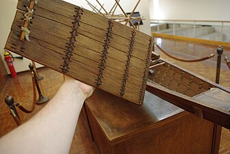 Model of the solar barge with the deck removed, showing the rope stitching that holds the planks together