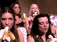 The shot of Madonna and her girlfriends watching a stripper as they eat bananas was seen as a nod to the Andy Warhol-penned cover for The Velvet Underground & Nico. Madonna deeper and deeper.jpg