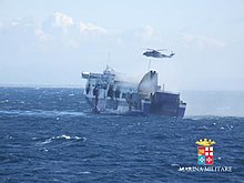 Norman Atlantic on fire, with rescue efforts underway. Photo from the Italian Navy. Norman Atlantic fire.jpg