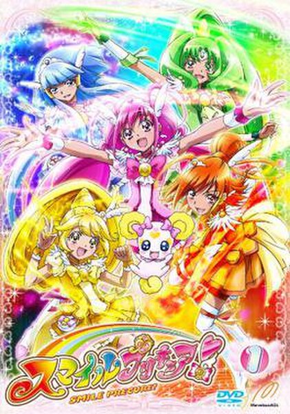 1st Japanese DVD volume of Smile Precure! distributed by Marvelous AQL, featuring the five Cures (from bottom left clockwise): Peace (yellow), Beauty/