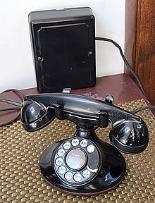 Western Electric 202 hand telephone set as refurbished in the late 1930s and 1940s with new handset style. The low-profile 684A subset (1931) is mounted on wall in background. Western Electric 202 hand telephone set with F1-handset 684A-subset--kbrose-2023.jpg