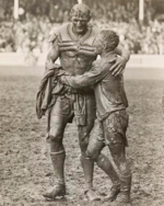 "The Gladiators", John O'Gready's famous photograph of the two opposing captains, Norm Provan and Arthur Summons, taken after the match. The Gladiators 1963.png