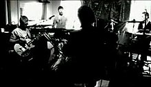 The second version of the video shows black-and-white footage of the band playing an acoustic version of the song.