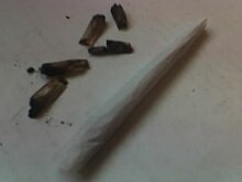 Several burnt roaches and a joint Roach joint comparison.jpg