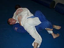 Brazilian Jiu-Jitsu practitioners 'Rolling' Half guard in Brazilian Jiu-Jitsu.jpg