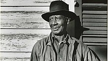 Tom Albert against a doorframe near his home in New Orleans, Louisiana September 25, 1954.